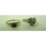 An 18ct gold solitaire diamond ring in heart shaped setting,