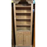 A narrow pine 4 shelf bookcase/wall unit with 2 under doors and drawers 74 x 207cm high