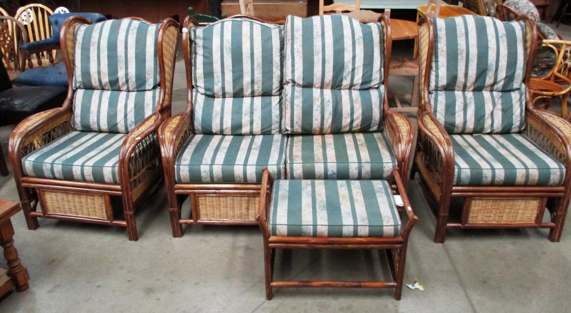 A bamboo framed 4 piece conservatory suite with green striped patterned cushions comprising 2