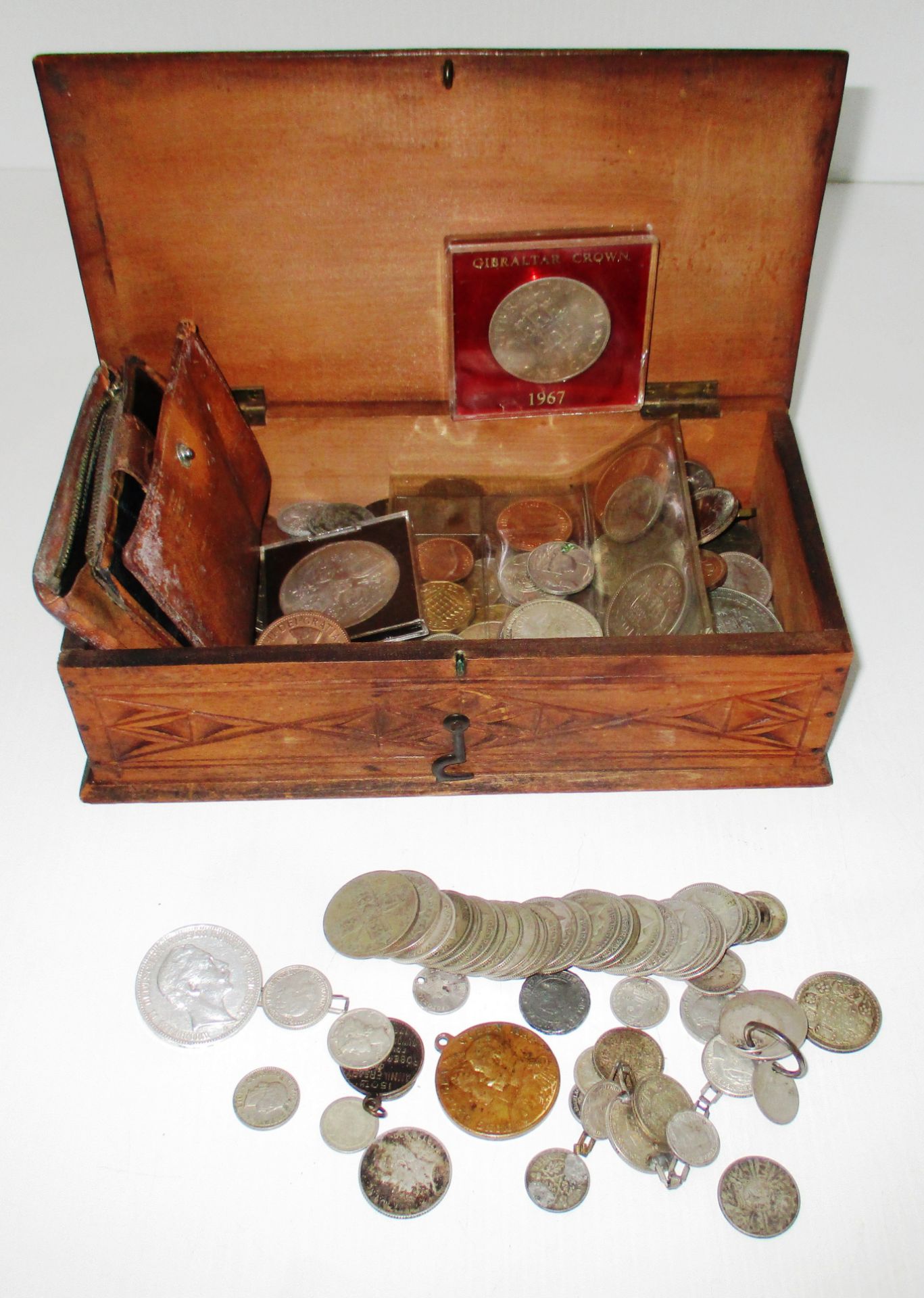 Carved wooden box and a quantity of mixed coins including some pre 1947 silver