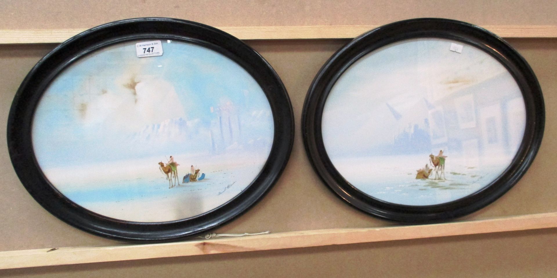 Frank Holmes (1912-2004) a pair of watercolours in oval frames 'Desert Scenes' each 29 x 37cm -