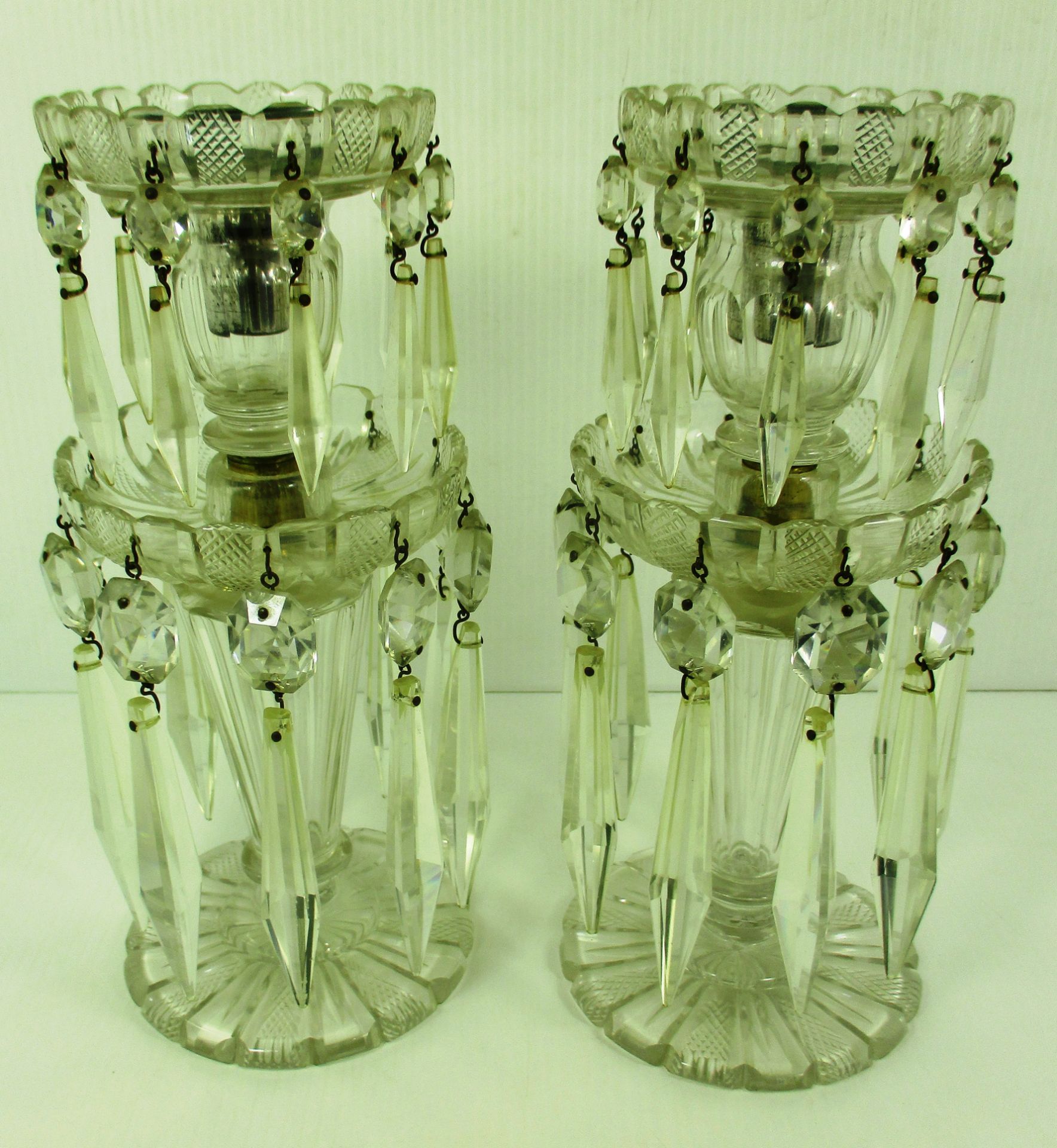 A pair of prismatic cut glass two tier Regency style lustres,