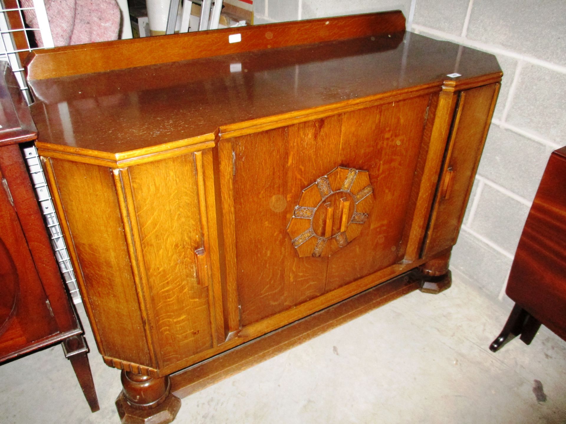 An oak Art Deco style sideboard 135cm