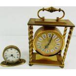 An Imhof gilt brass mantel clock with four twisted pillars, carrying handle,