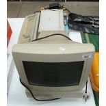 An Amstrad PCW 9512 personal word processor computer with monitor, keyboard,