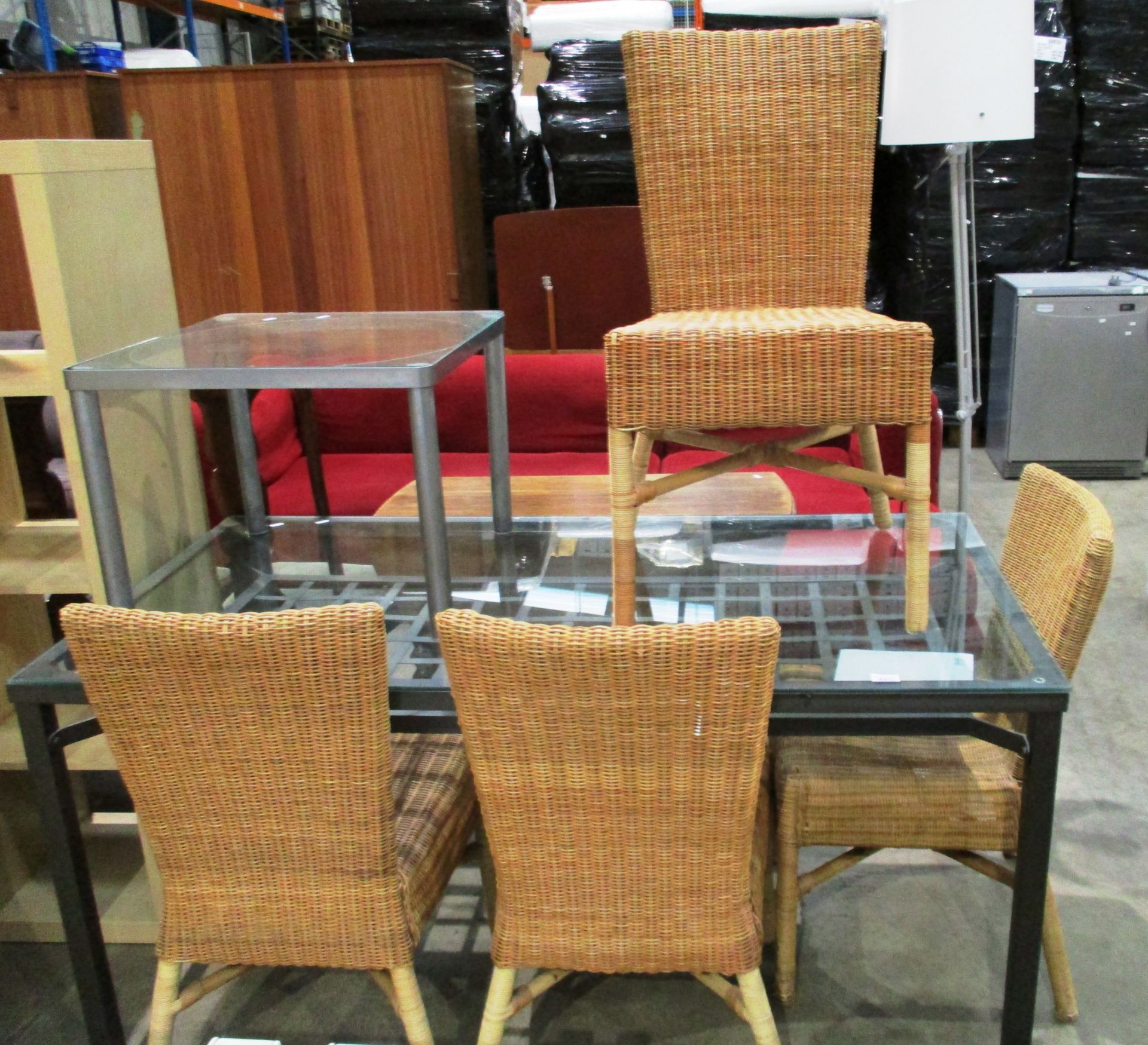 A grey metal framed glass topped dining table with under tray 150 x 80cm, 4 x wicker dining chairs,