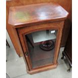 A Victorian single glazed door side cabinet in mahogany veneered in English walnut with canted