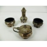 A four piece silver cruet set comprising pepper pot, salt cellar and pair of mustard pots,