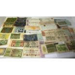 A quantity of assorted bank notes including Sudan one pound 1961, Lybia, Germany etc.