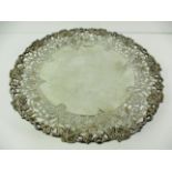 A circular silver comport/tazza with hand pierced fruiting vine border, on circular pedestal foot,