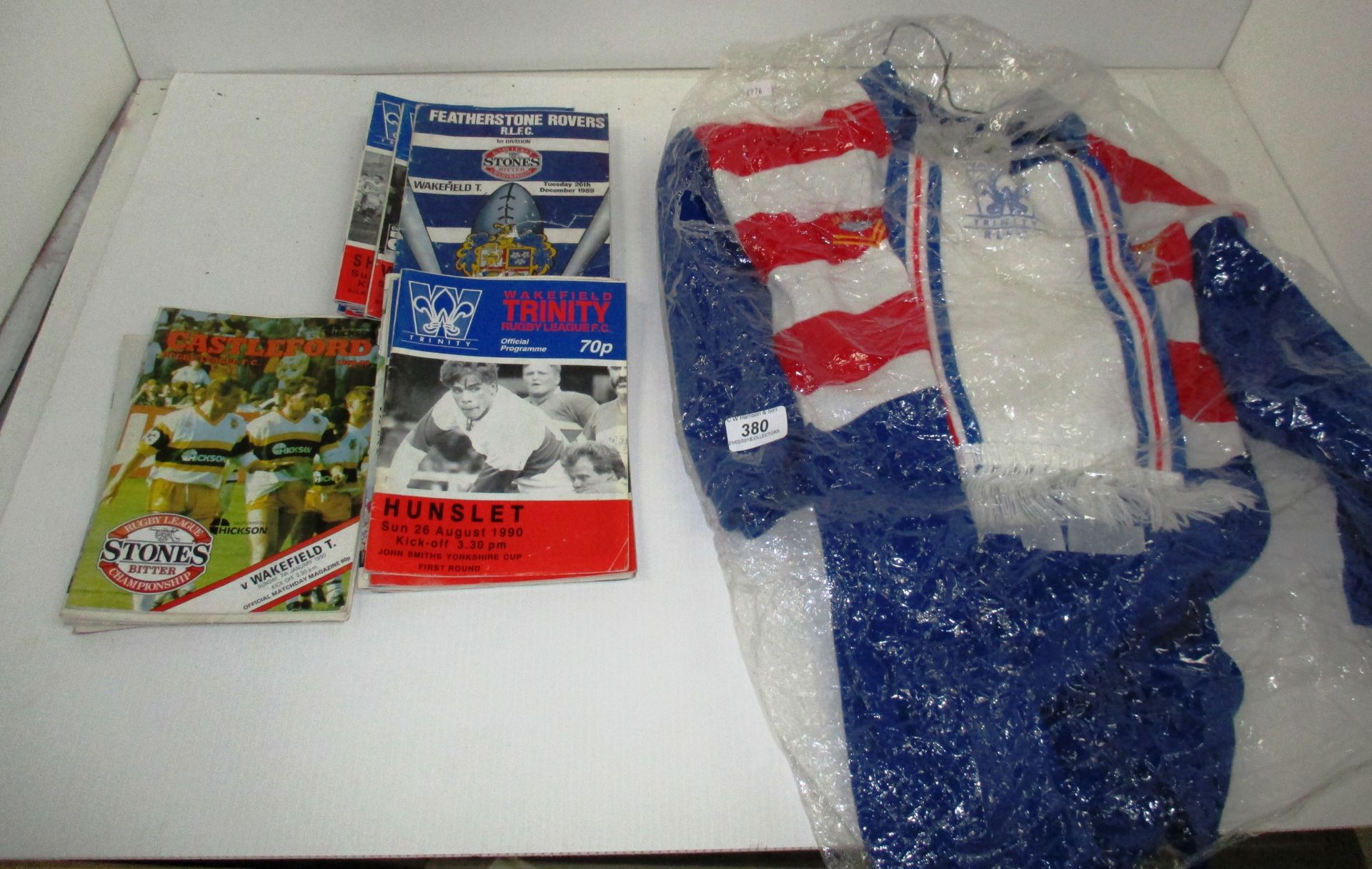 A Bukta Wakefield Trinity junior shirt and scarf from the 1989 season and 19 programmes featuring