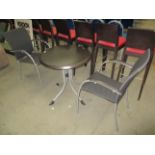 Brown plastic topped circular garden table 70cm on metal frame and 2 matching armchairs