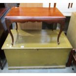 A brown painted blanket box and a mahogany tow table on cabriole legs (2)