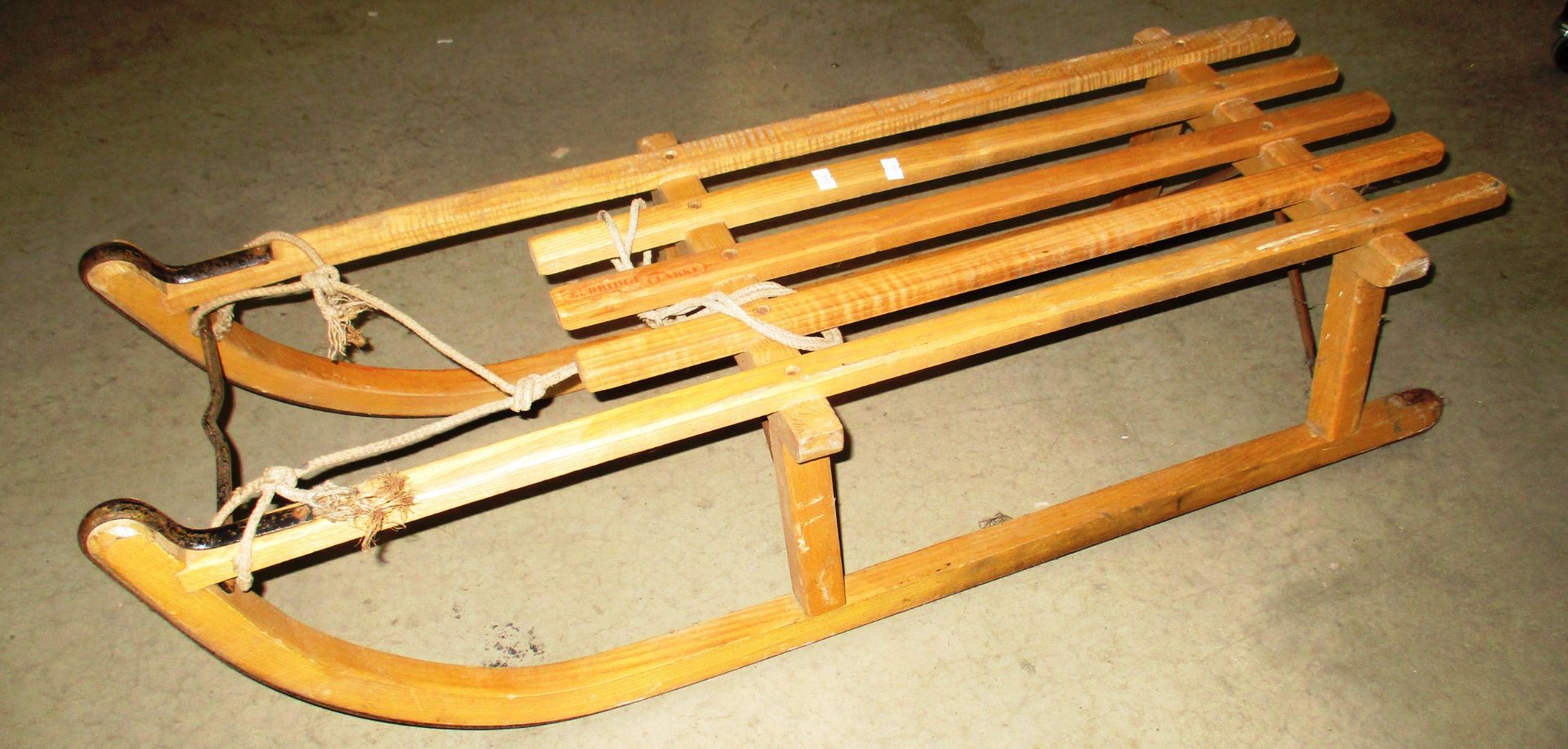 A traditional wooden toboggan/sledge