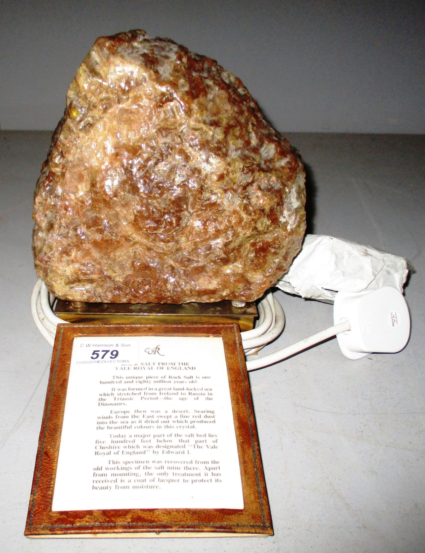An unusual table lamp made from Rock Salt from the Vale Royal of England mounted on a brass stand