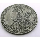 A replica 1562 Elizabeth I milled shilling coin