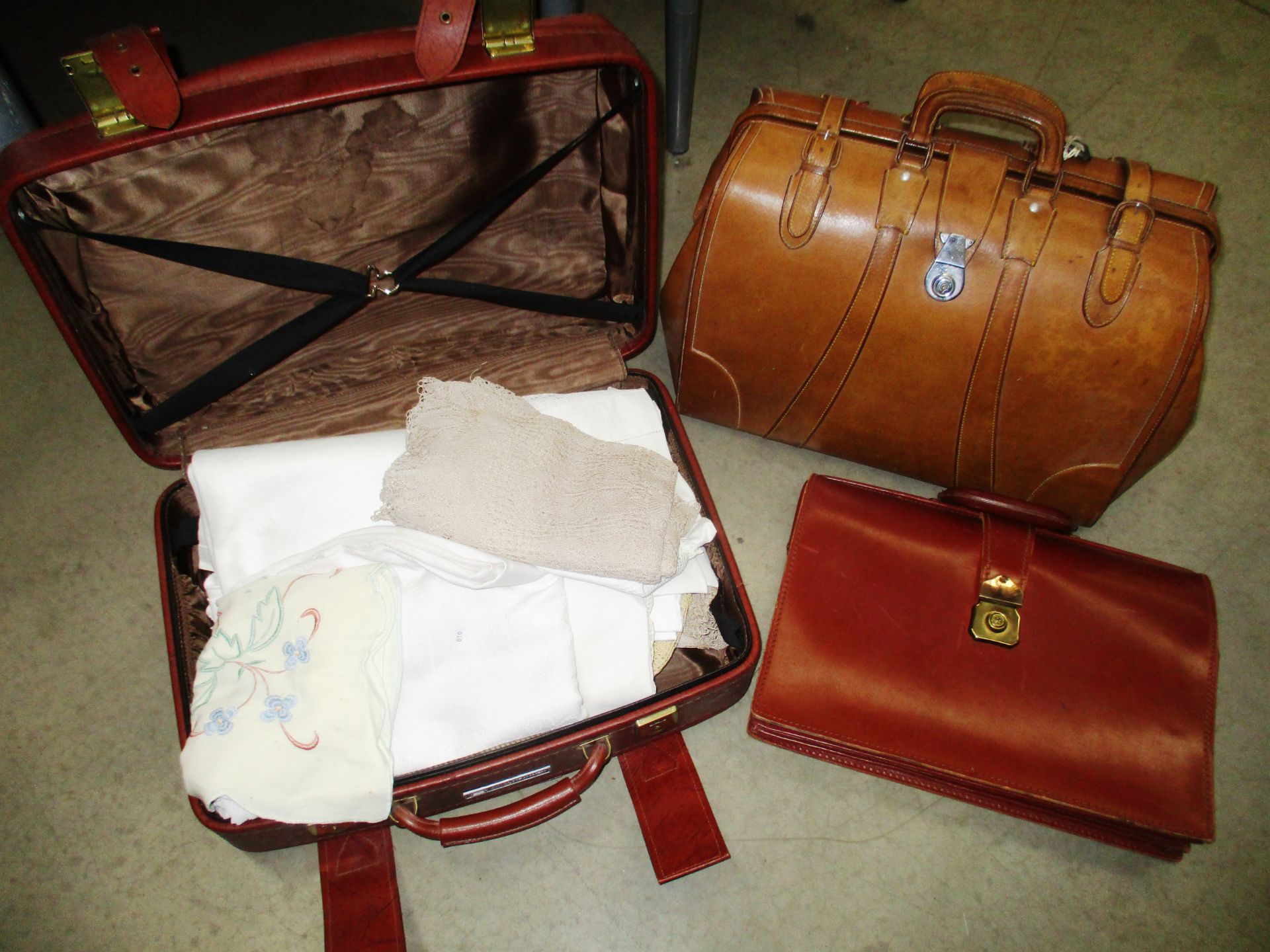 A brown leather holdall,