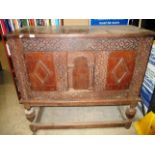 An 18th Century style inlaid and carved 2 door oak cupboard on stand 130 x 116cm high