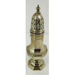 A small silver sugar caster shaker with octagonal shaped baluster body,