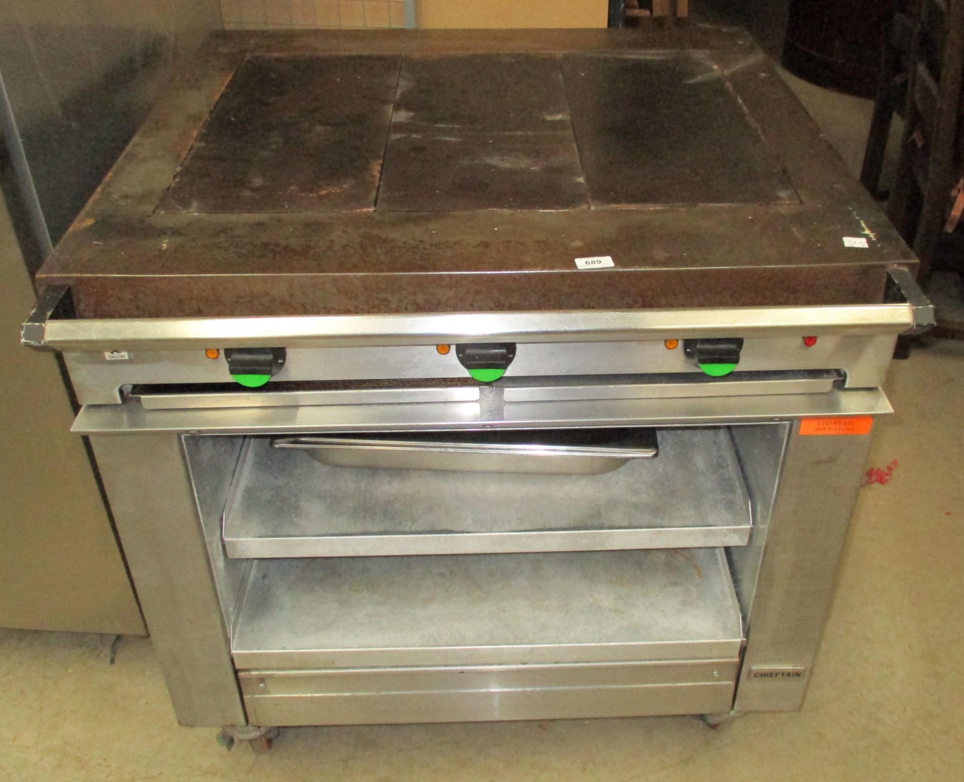 A Falcon Chieftain stainless steel three hot plate electric boiling table on mobile base 3 phase