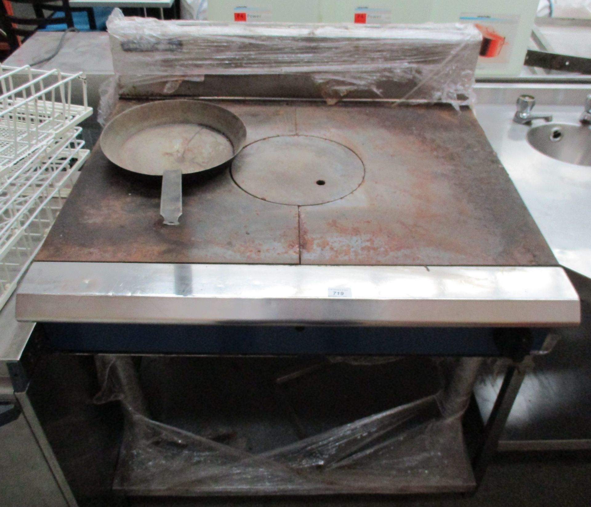 A stainless steel griddle - gas fired complete with frying pan