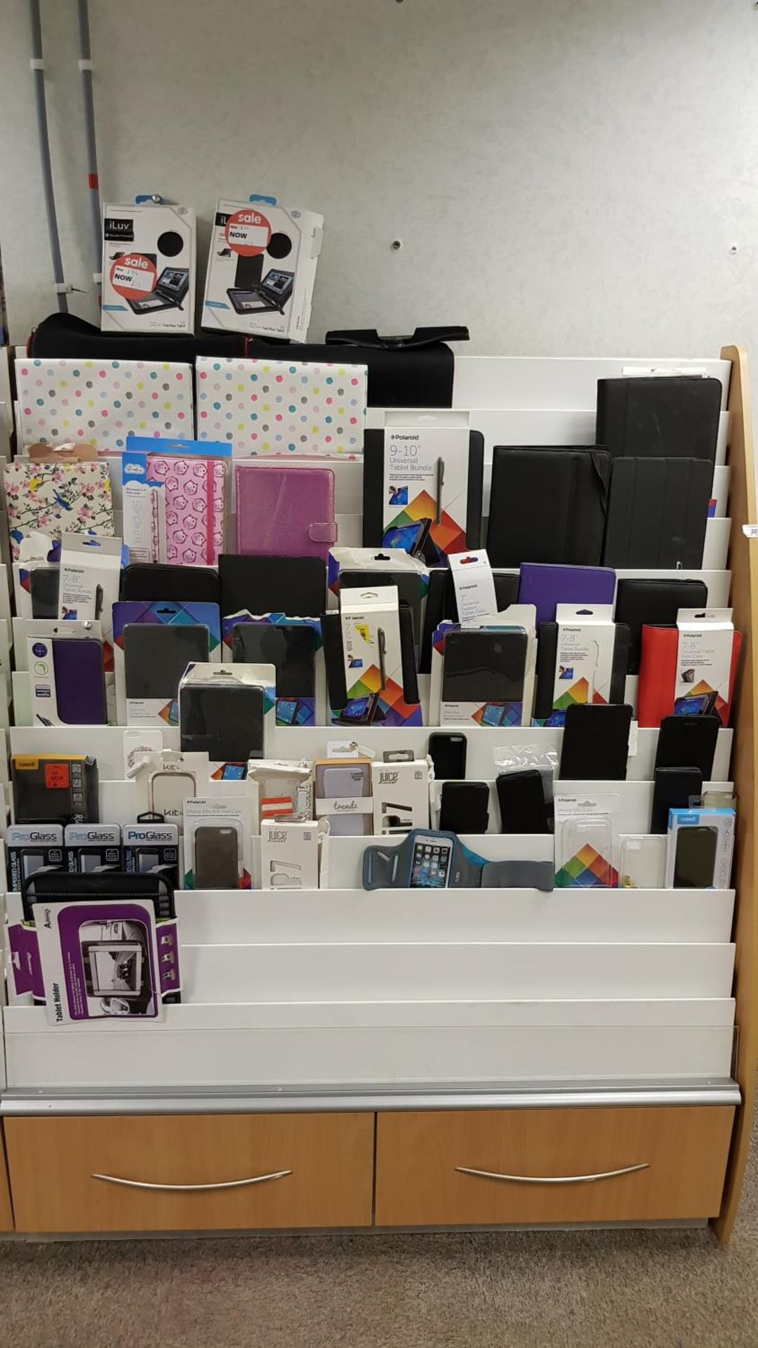 Contents of Display Cabinet – Approx (50x) mixed tablet/phone cases & covers