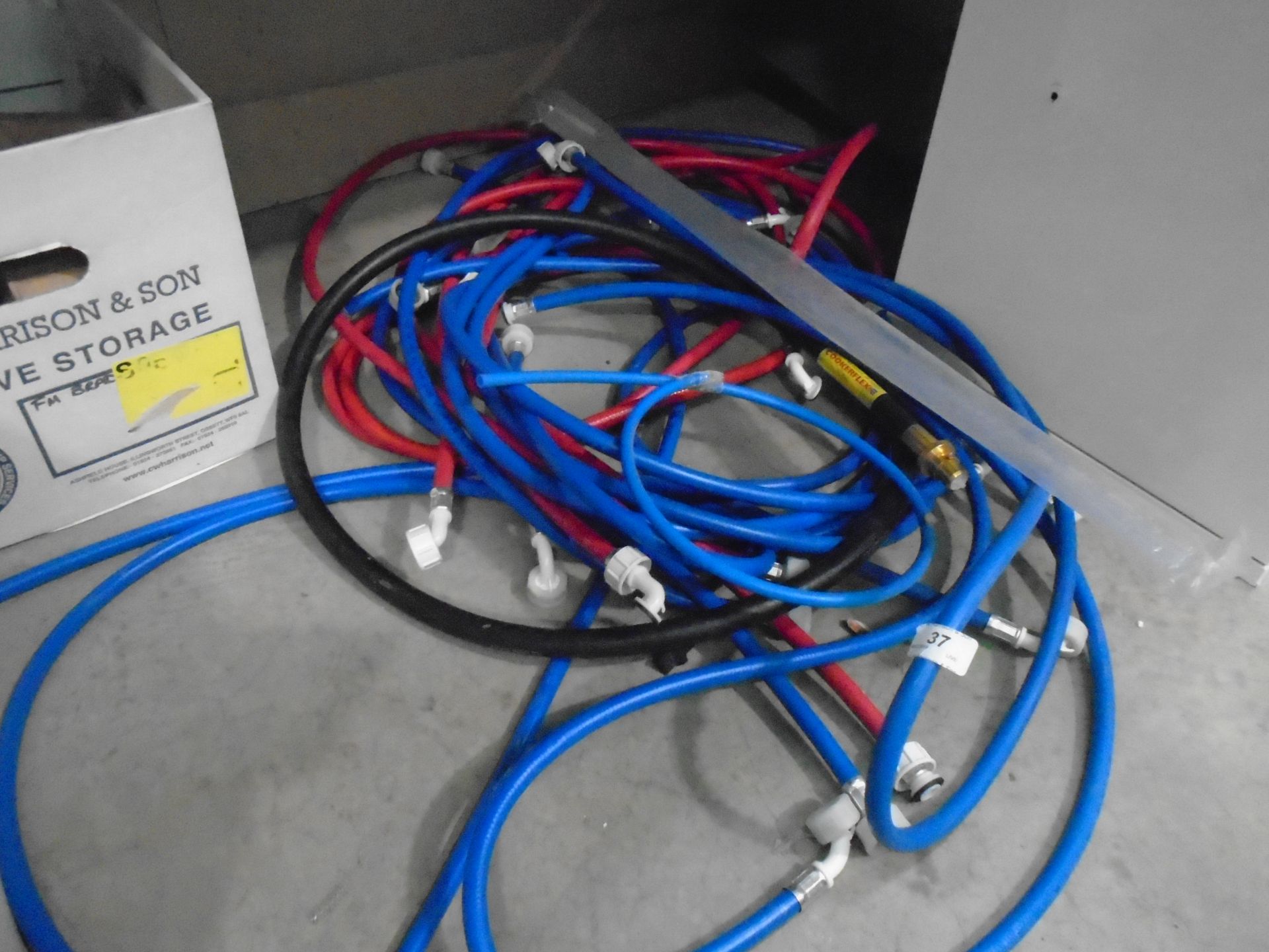 A quantity of hot and cold washing machine hoses