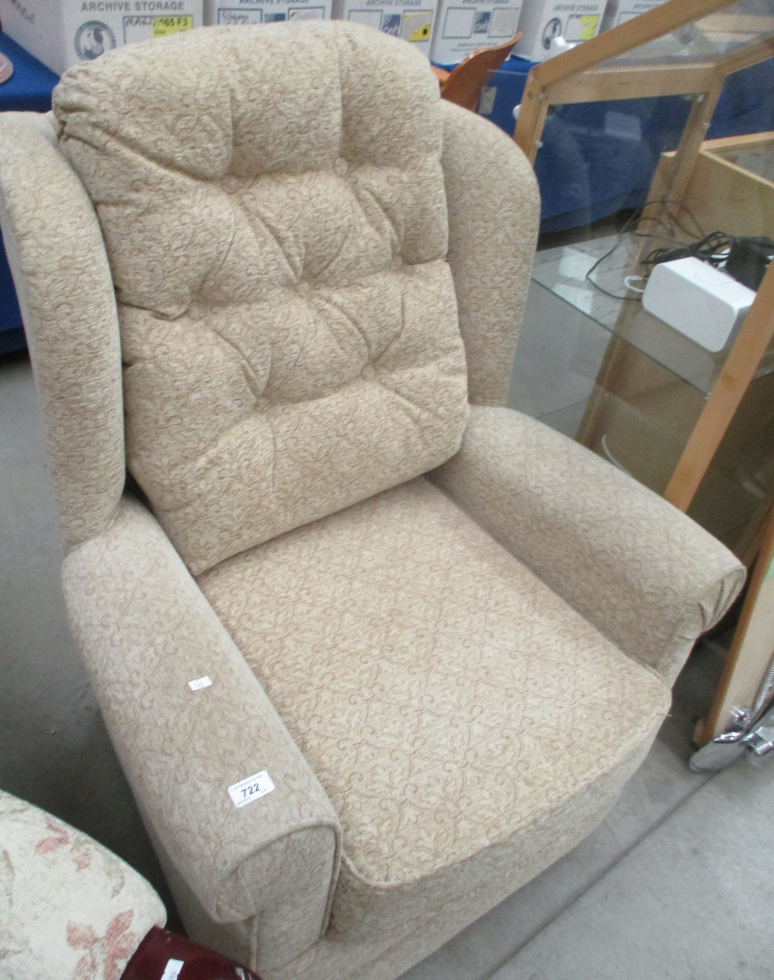 A brown oatmeal patterned armchair