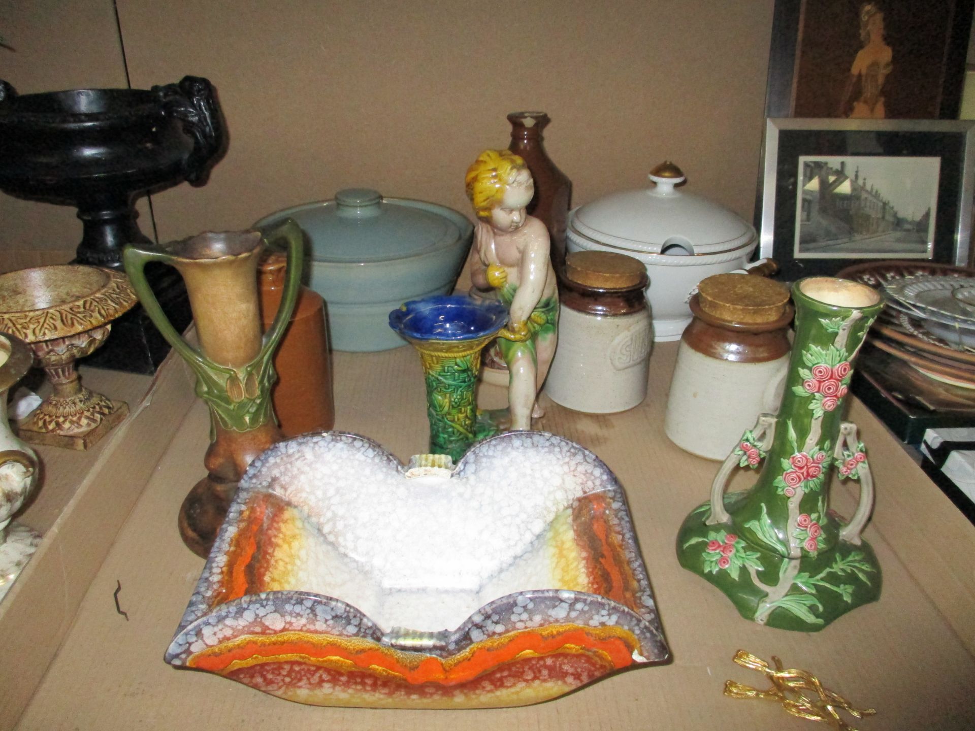 A quantity of assorted pottery and ceramics including stoneware jars, green glaze candlestick,