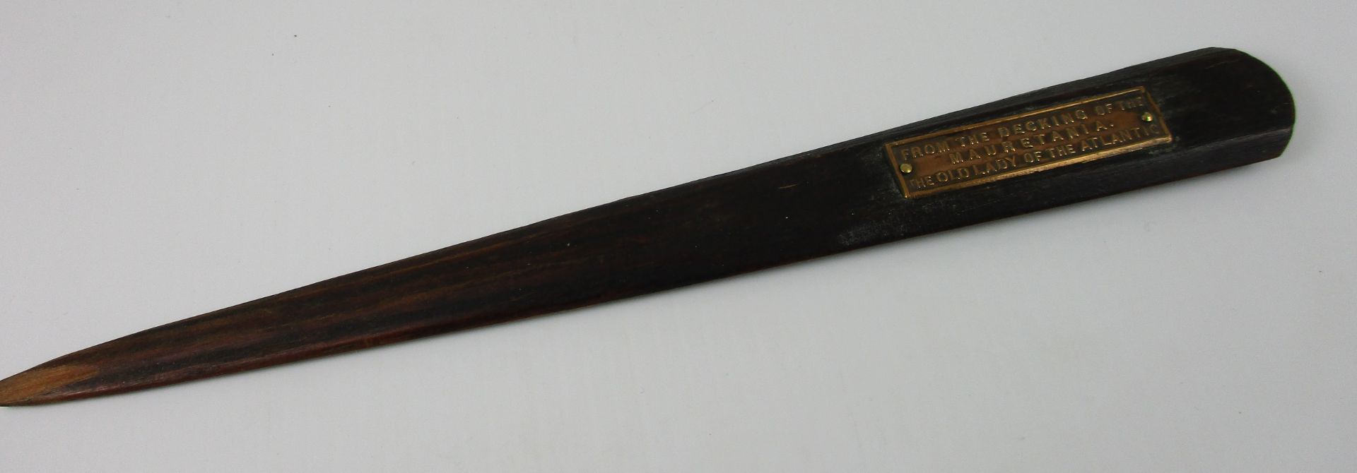 A wooden letter opener carved from the decking of the Mauritania "The Old Lady of the Atlantic"