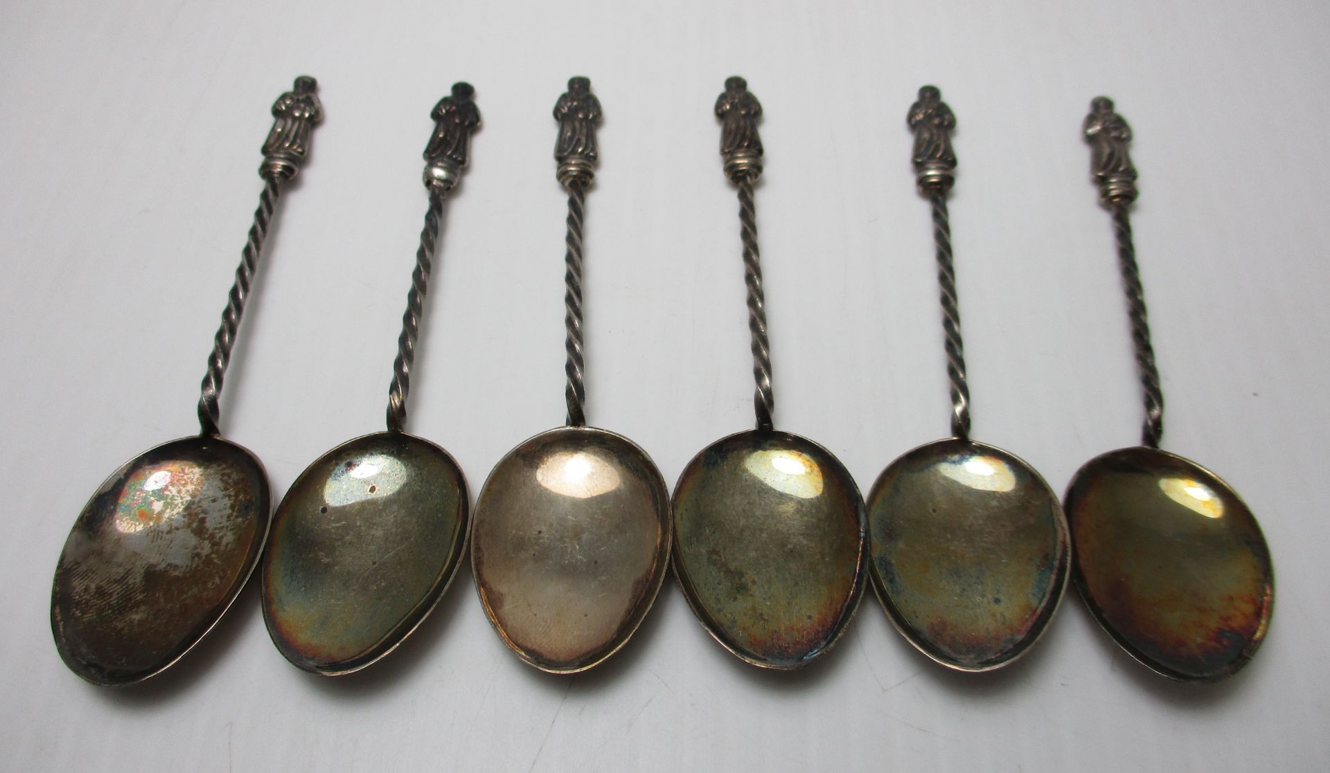 A set of six silver Apostle coffee spoons by Henry Hobson & Sons,