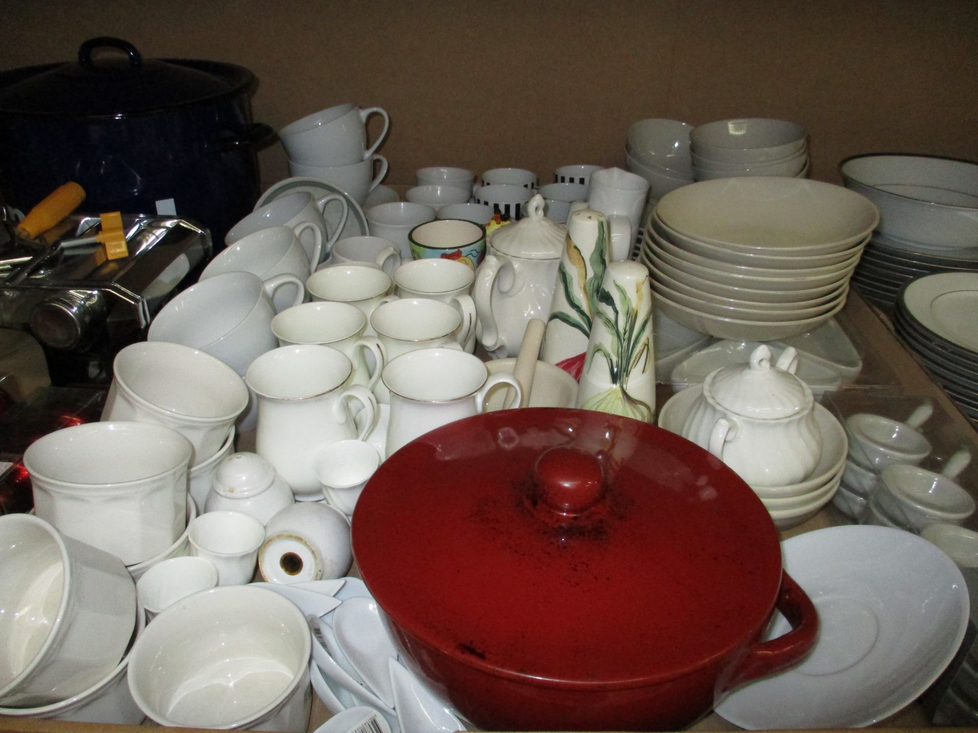 A large quantity of assorted pottery and china tea/dinner services