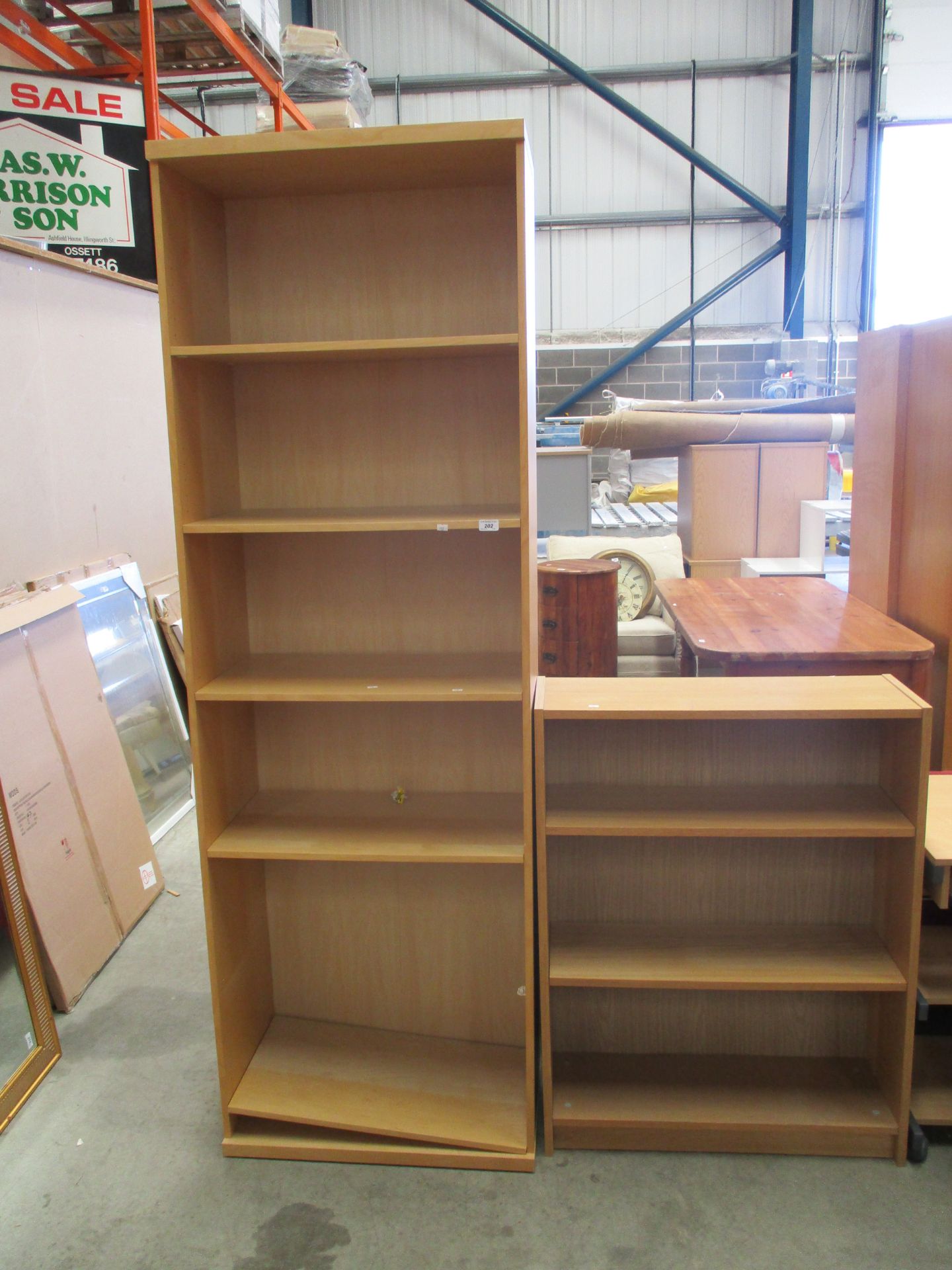 A tall pine finish open bookcase 6 shelf and a low oak finish 3 shelf bookcase (2)