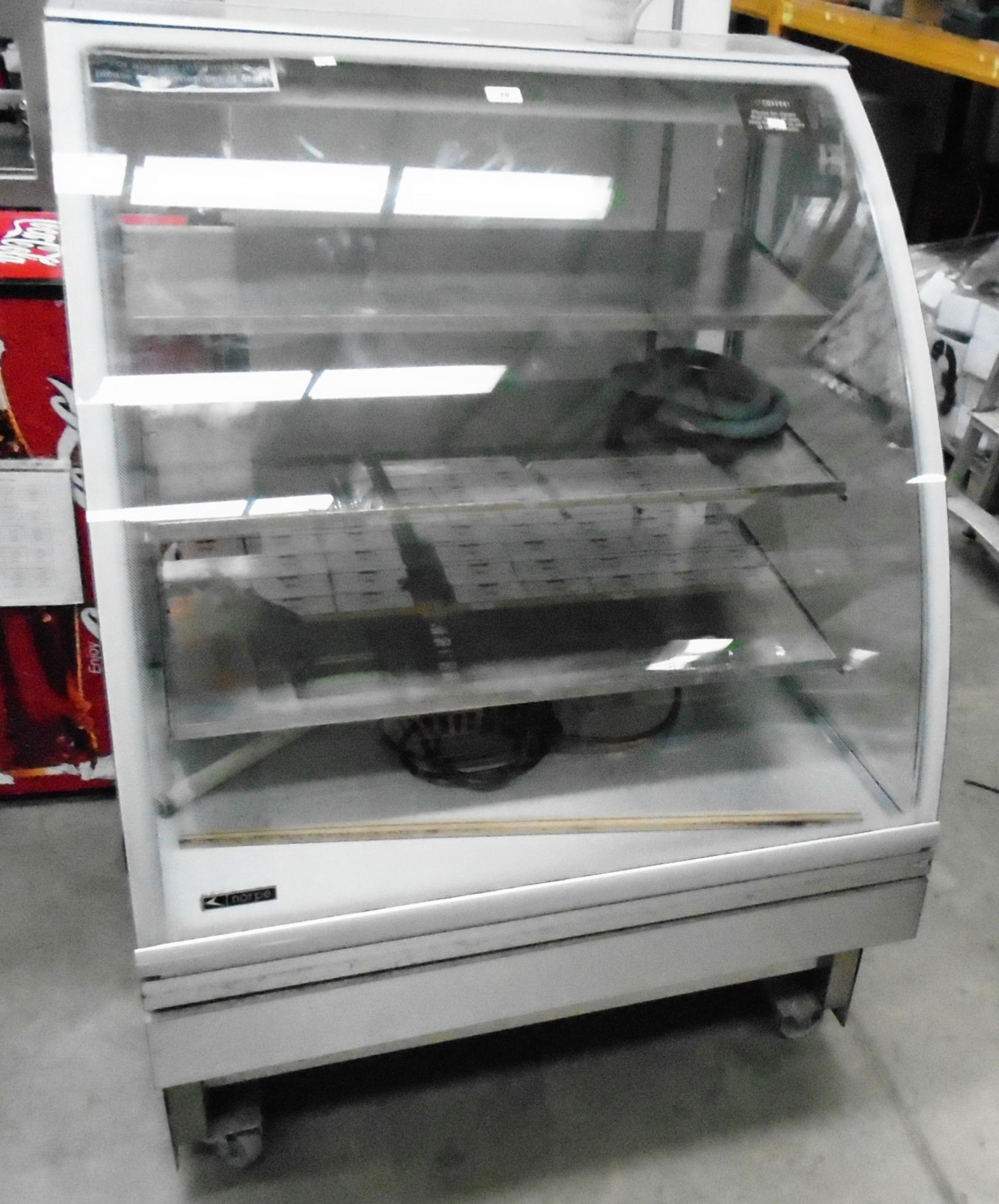A Norpe Saga 90-W-RST curved glass front mobile food display unit - 240v