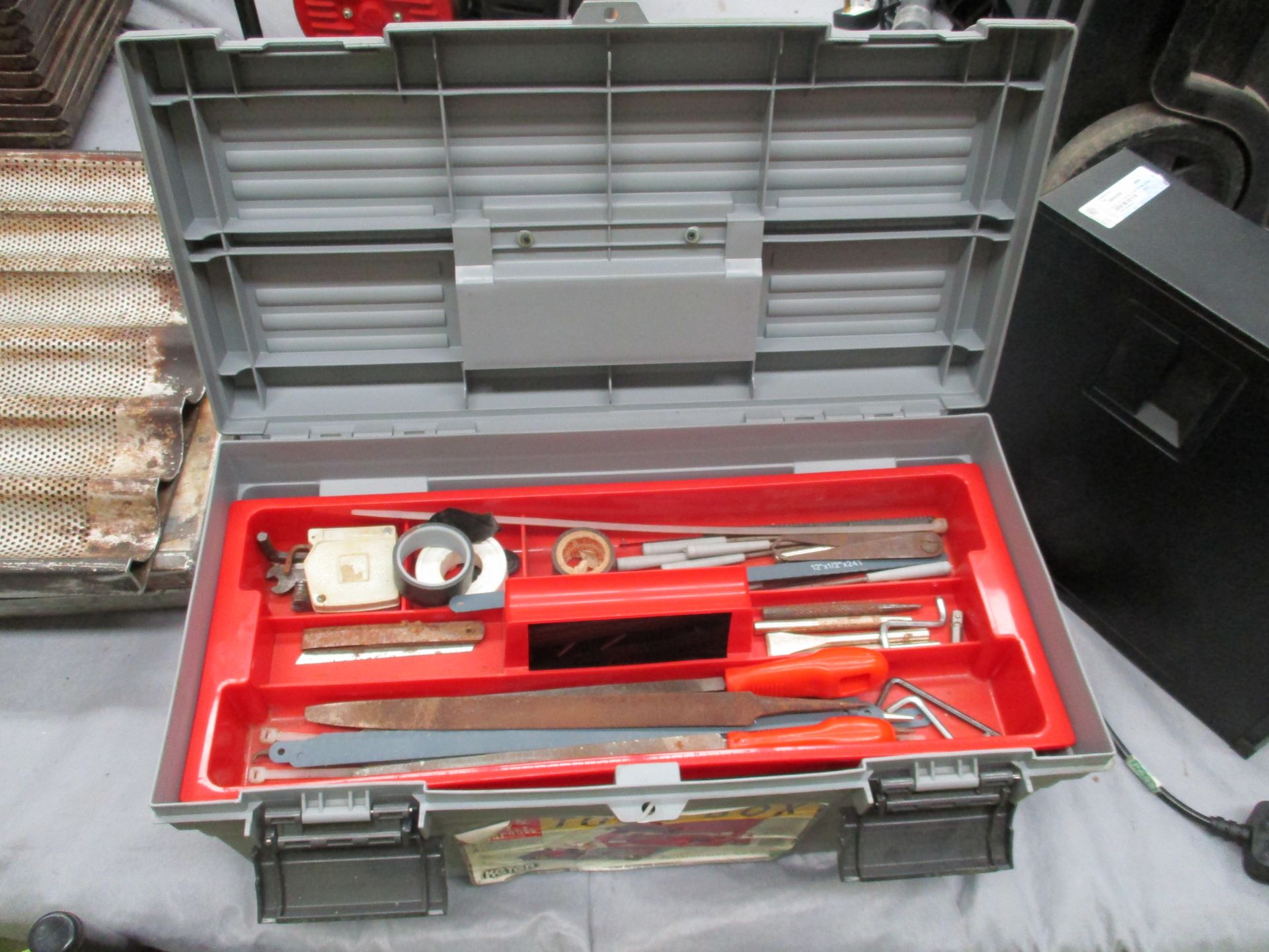 A Keter grey plastic tool box with contents - spanners, hammer, screwdrivers,