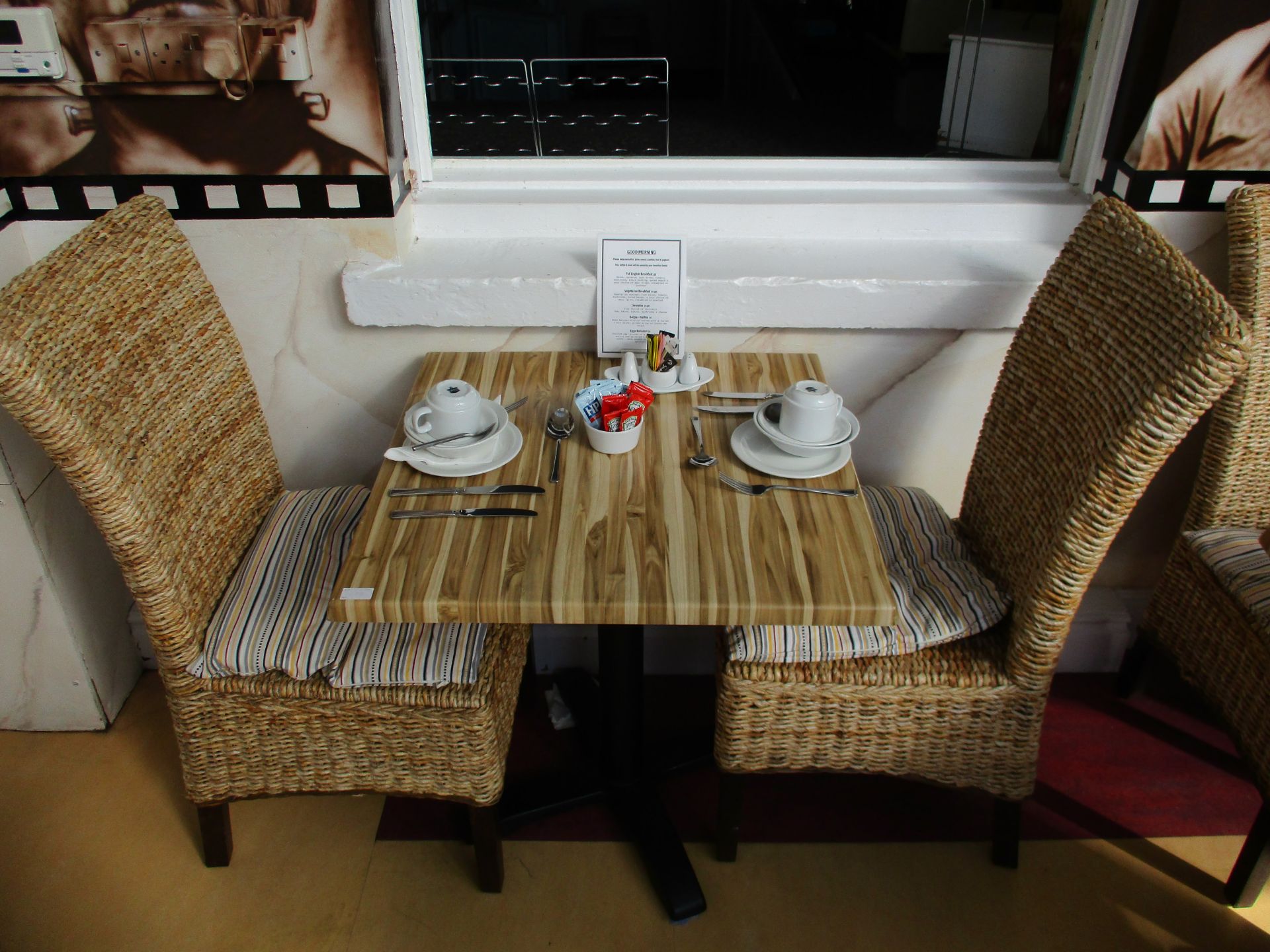 Wood effect laminated table 70cm x 70cm complete with 2 wicker chairs