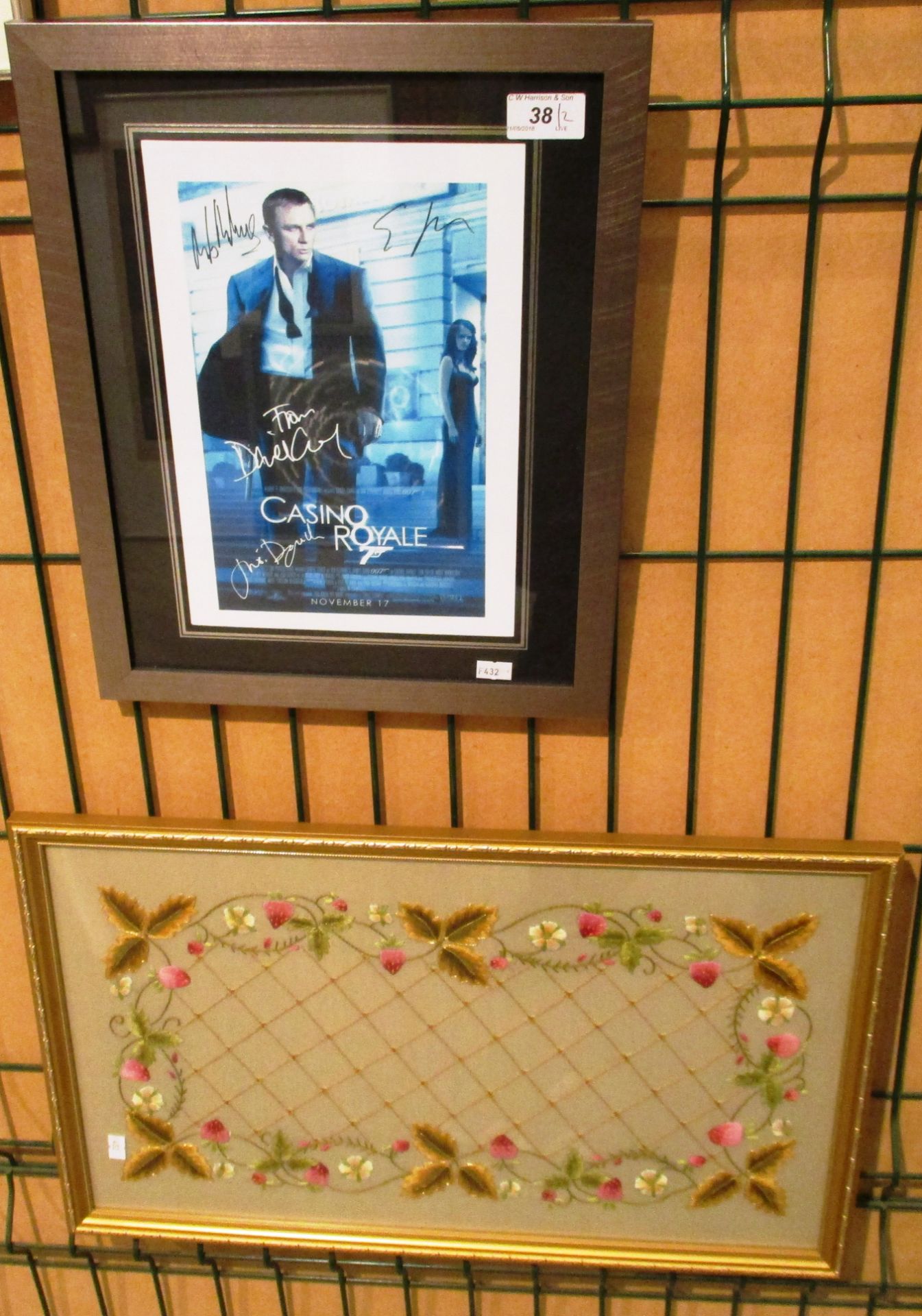 Small framed photo print 'Casino Royale' with facsimile signatures and a framed embroidered picture