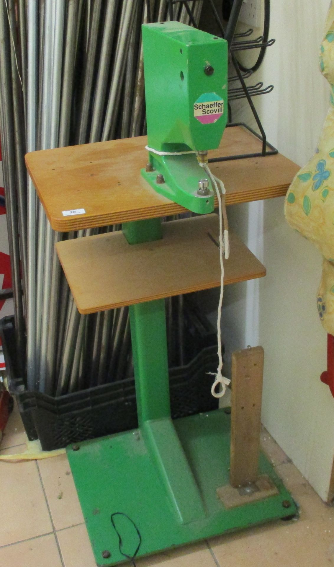 Green painted manual eyelet machine