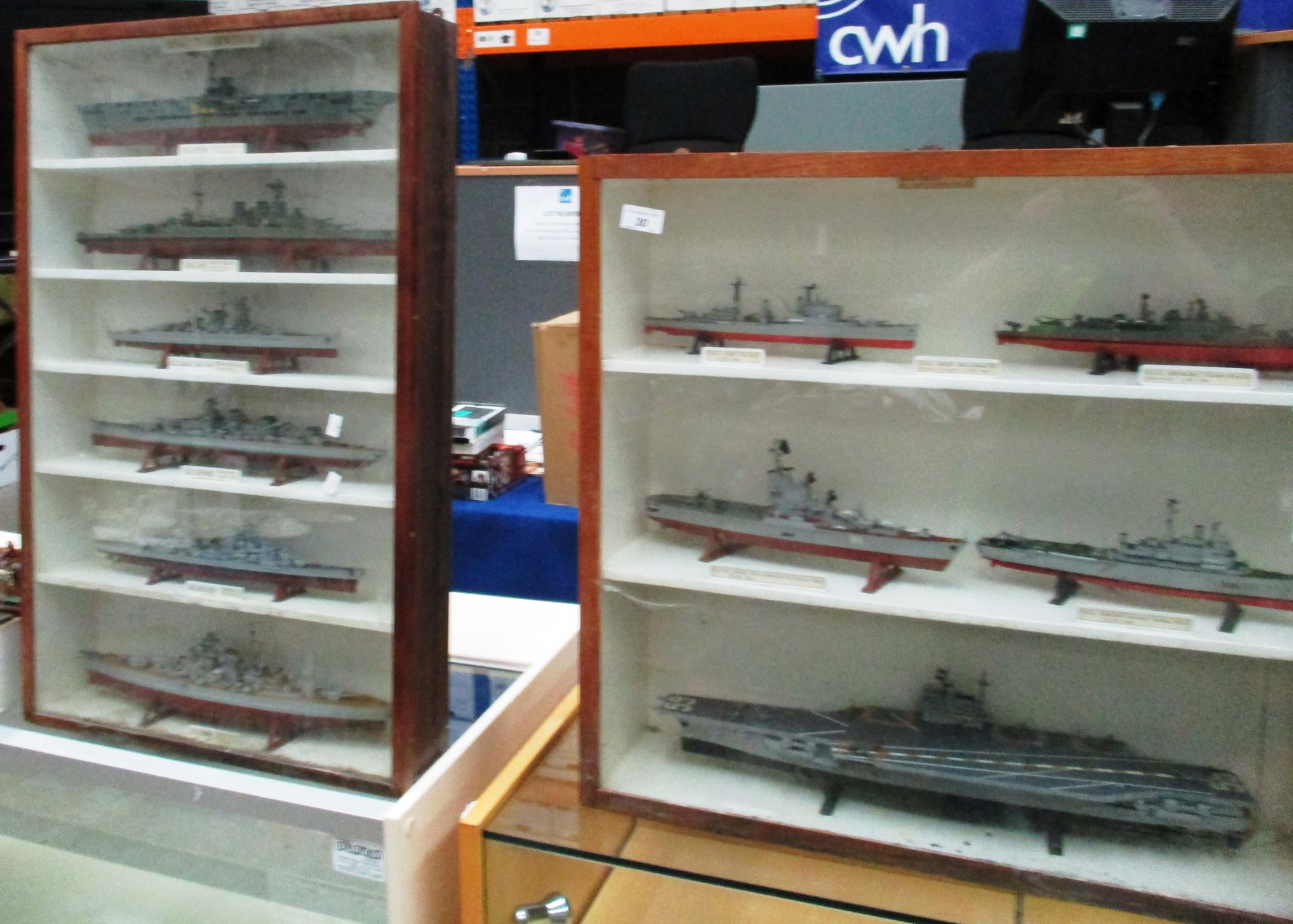 2 display cabinets containing plastic kit built modern warships circa 79/80 and 2nd World War