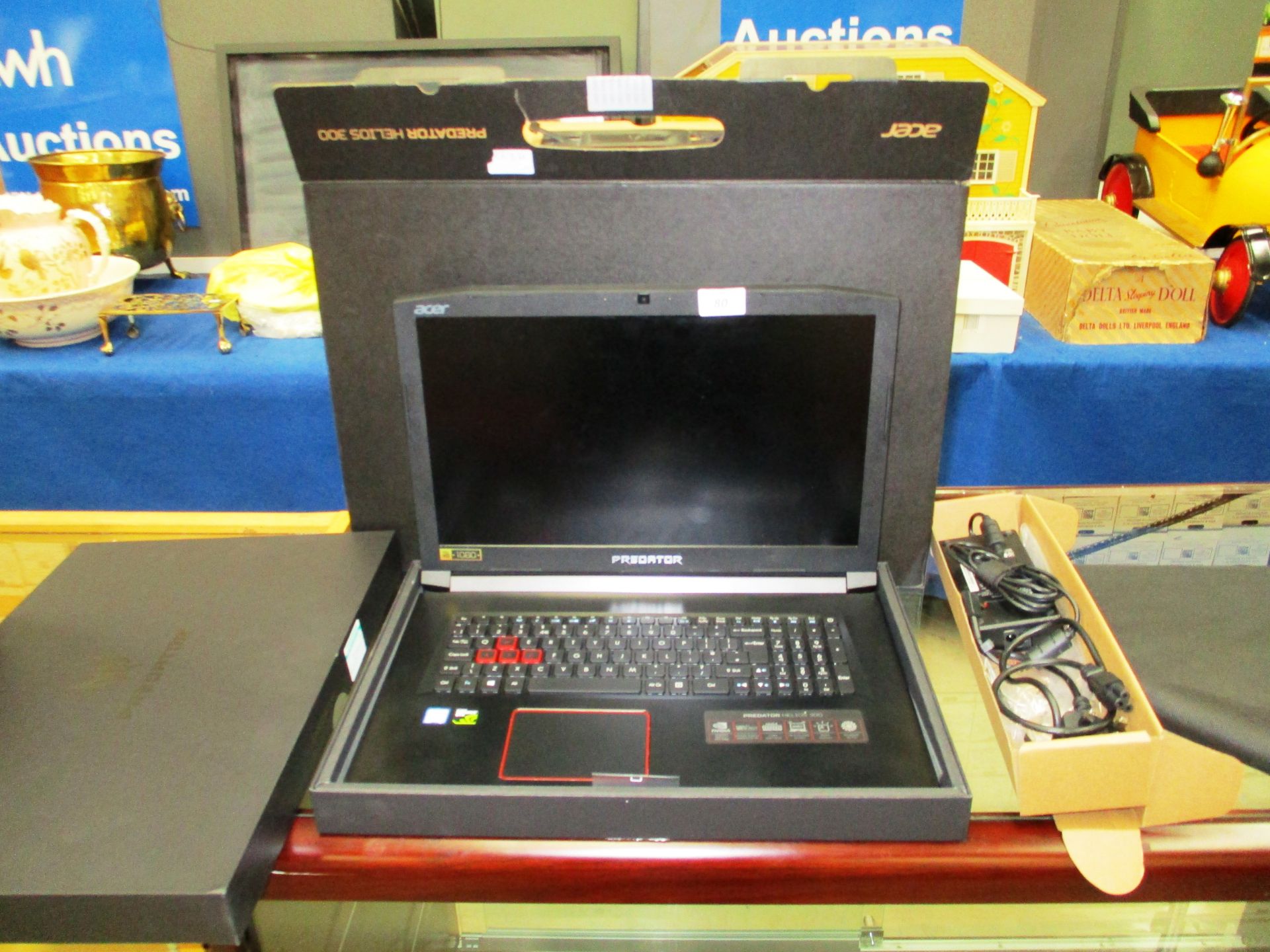 An Acer Predator Helios 300 laptop computer complete with adaptor and original box