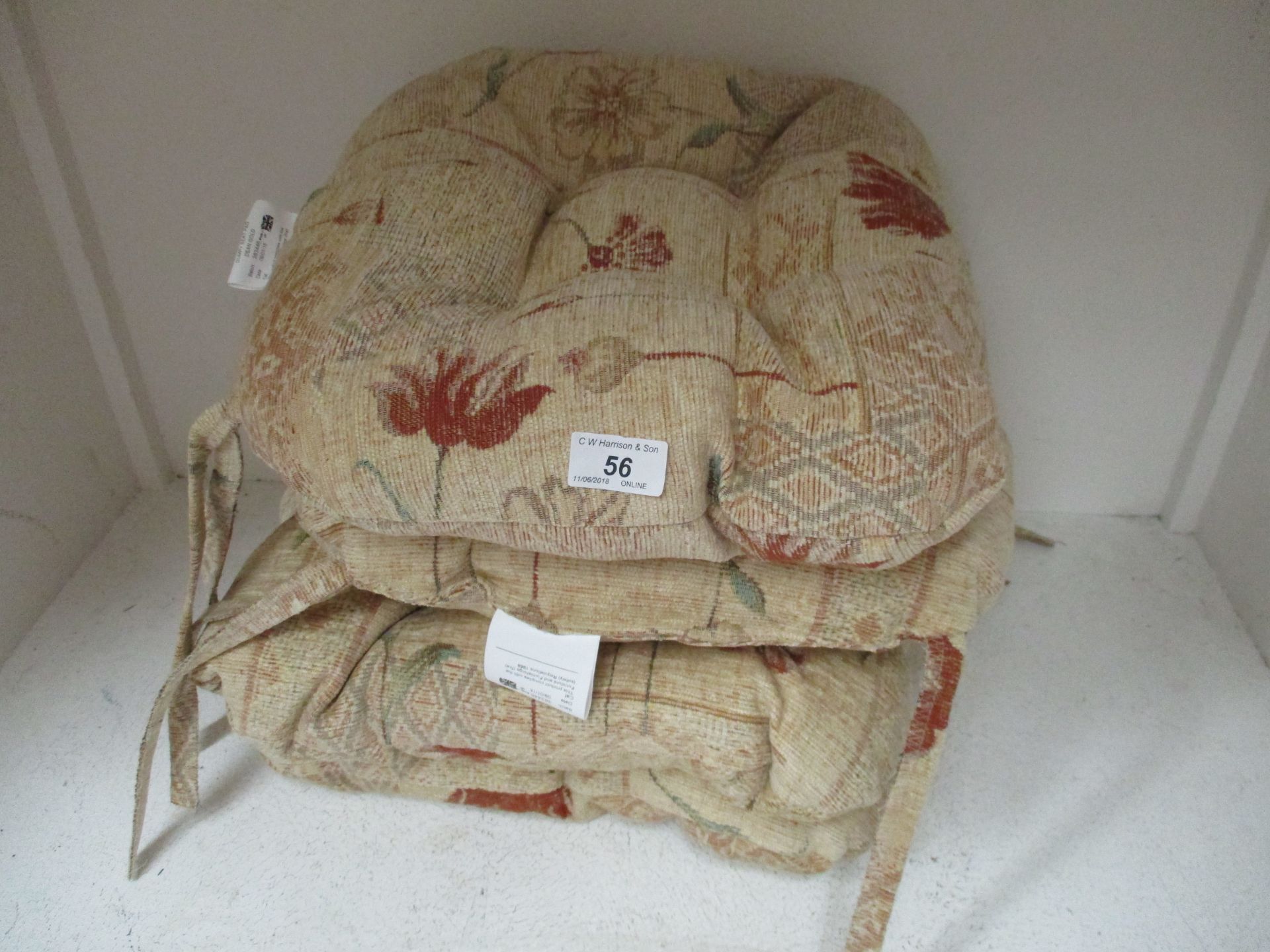 A set of four brown floral upholstered s