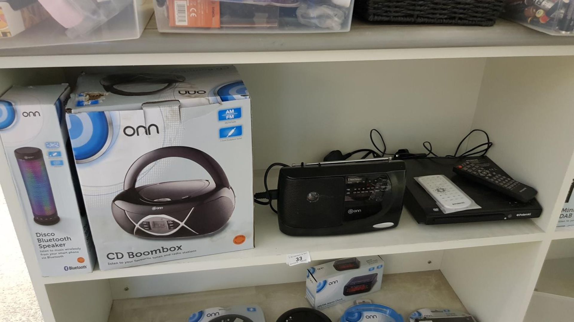 Contents of Shelf – to include Polaroid DVD Player, Onn CD Boombox,