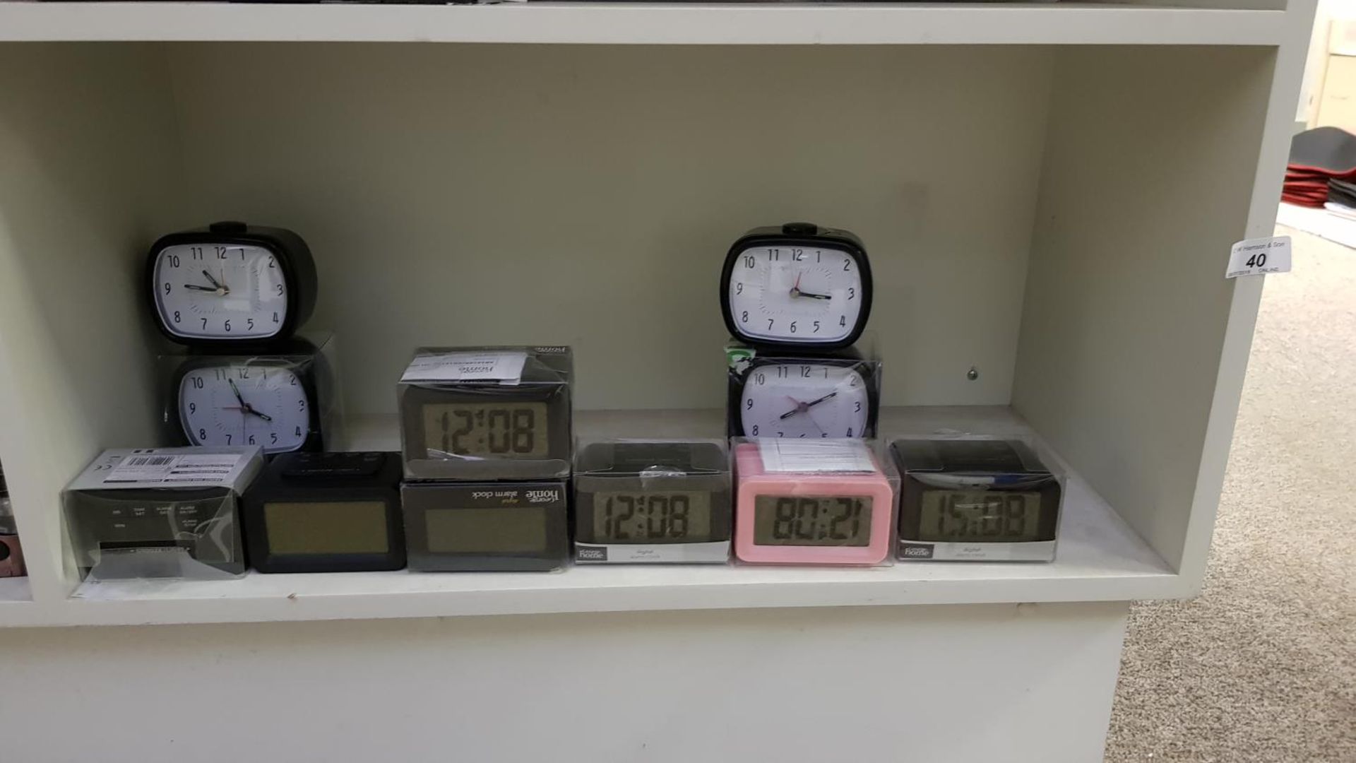 Contents of Shelf – (7x) Digital Alarm Clocks & (4x) Analogue Alarm Clocks