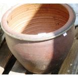 A terracotta planter 32cm high