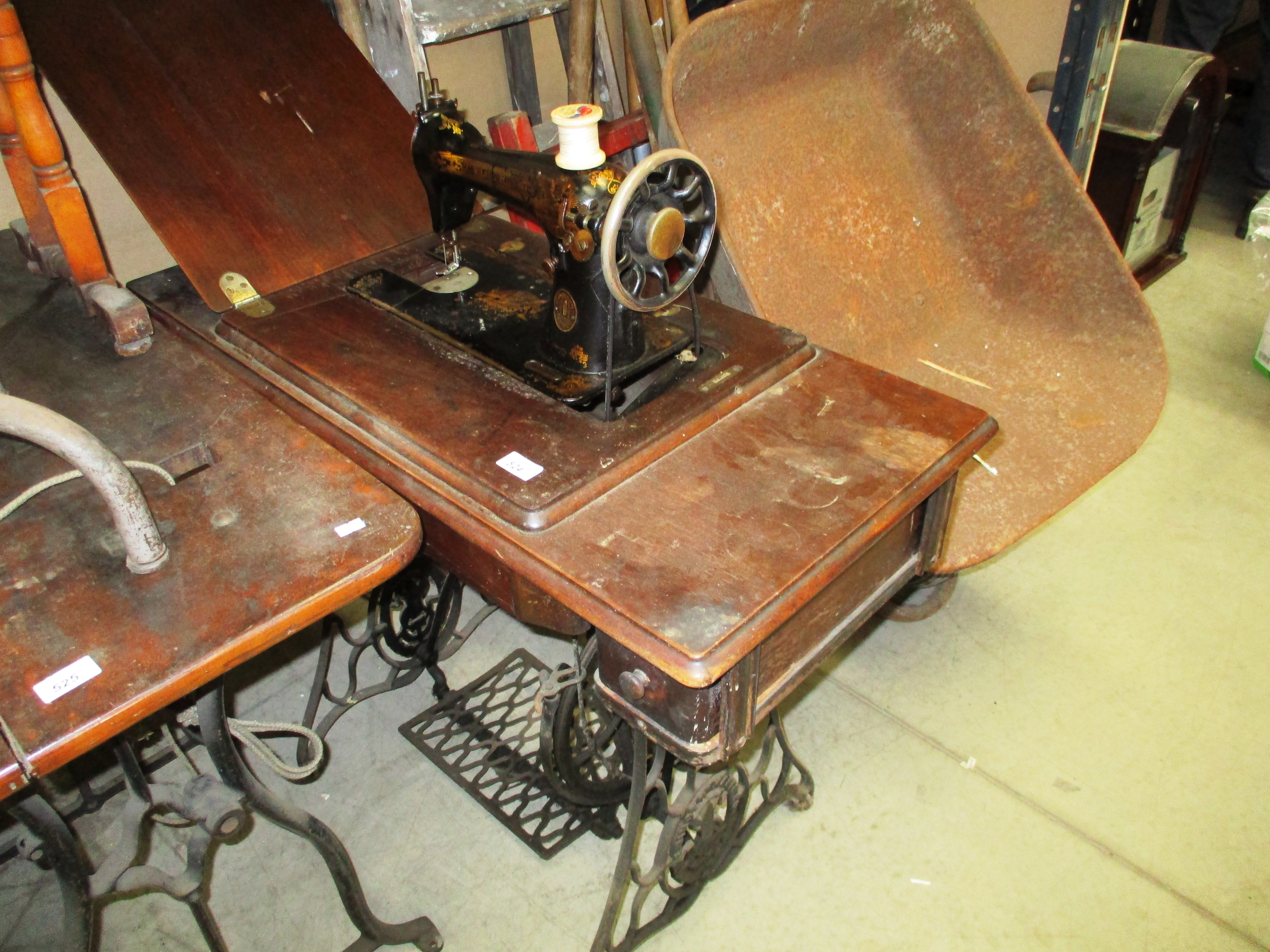 Singer manual sewing machine in wooden case on treadle base