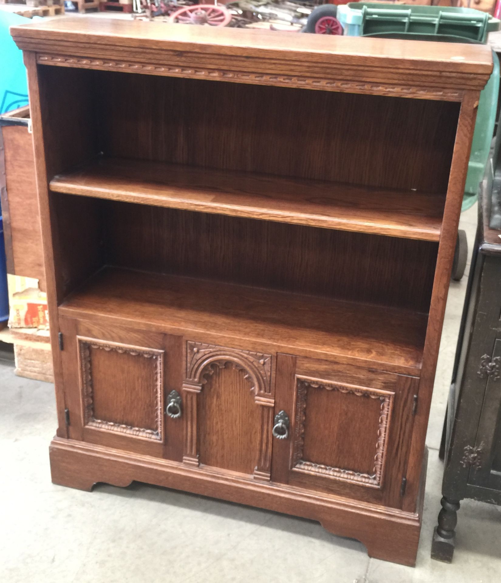 Oak two drawer bookcase with two drawer cupboard below - 102 cm high