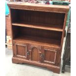 Oak two drawer bookcase with two drawer cupboard below - 102 cm high