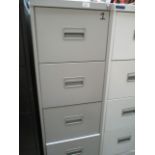 A grey metal four drawer filing cabinet (unlocked no keys)