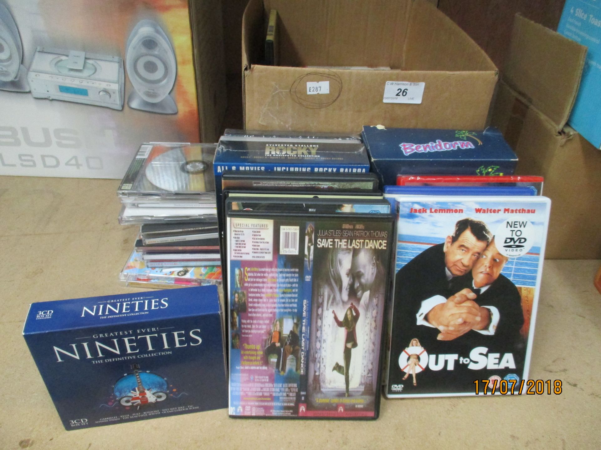 Contents to box - DVDs, CDs, playing cards,