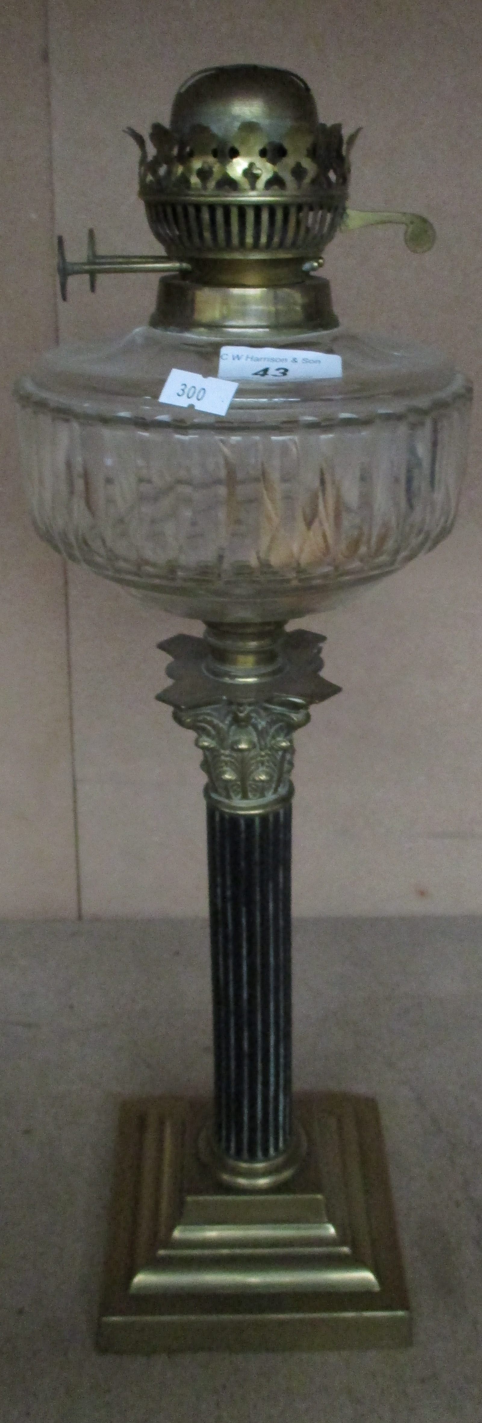 A brass Corinthian column oil lamp